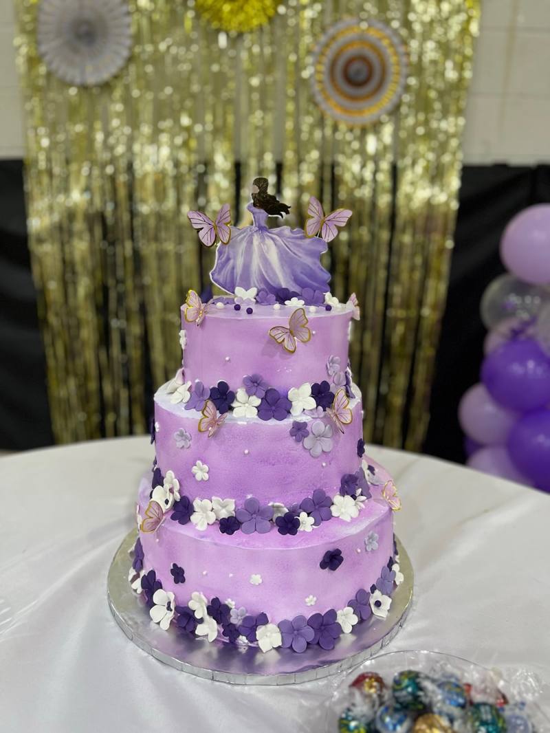 Lavender three tier quinceañera cake with ballgown doll topper and butterflies by Cakes by Steph