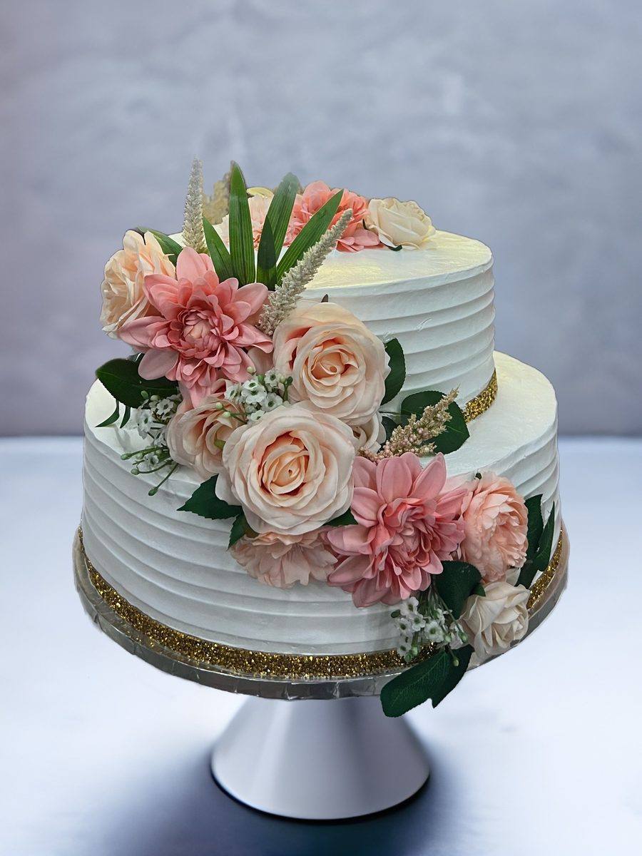 Two tier wedding cake with cascading blush and peach roses by Cakes by Steph, Leesburg VA