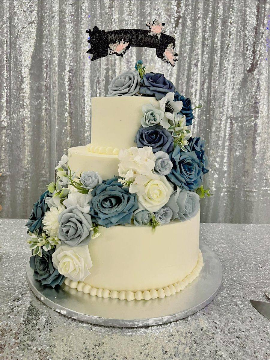 Dusty blue floral three tier wedding cake by Cakes by Steph